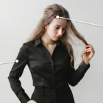 Girl with problem of oily roots and dry ends hair.