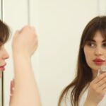 Girl applying serum in correct method to avoid mulling.